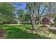 Expansive backyard with lush green grass and mature trees, perfect for outdoor activities and relaxation at 218 Kimrod Ln, Charlotte, NC 28270