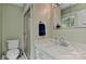 Bright bathroom featuring a shower, toilet, and vanity with marble countertop at 218 Kimrod Ln, Charlotte, NC 28270