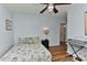 Cozy bedroom with hardwood floors, bedside table, a keyboard and ample light at 218 Kimrod Ln, Charlotte, NC 28270