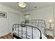 Well-lit bedroom with wood floors, windows, white trim, and a comfortable bed at 218 Kimrod Ln, Charlotte, NC 28270