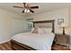 Well-lit bedroom showcases a comfortable bed, hardwood floors, and closet storage at 218 Kimrod Ln, Charlotte, NC 28270
