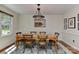 Cozy dining room featuring a wooden table with seating for six and a decorative chandelier at 218 Kimrod Ln, Charlotte, NC 28270
