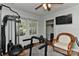Home gym featuring various workout equipment, wood floors, and a comfortable chair at 218 Kimrod Ln, Charlotte, NC 28270