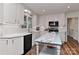 Lovely kitchen with white cabinetry, modern appliances, tile backsplash, and a central island prep area at 218 Kimrod Ln, Charlotte, NC 28270