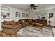 Cozy living room with hardwood floors, a ceiling fan, and comfortable, neutral-toned furniture at 218 Kimrod Ln, Charlotte, NC 28270