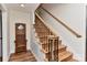 Elegant staircase with wood treads, decorative iron railings, and pristine white walls at 218 Kimrod Ln, Charlotte, NC 28270