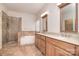 Luxurious bathroom with a glass-enclosed shower, soaking tub, and double vanity at 2415 Tory Oak Pl, Matthews, NC 28105