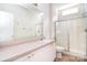 A bright full bathroom provides a shower with glass doors and a well-lit vanity at 2415 Tory Oak Pl, Matthews, NC 28105