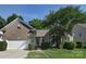 Charming brick home with a well-manicured lawn and attached two-car garage at 2415 Tory Oak Pl, Matthews, NC 28105