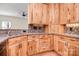Kitchen with wood cabinets, granite counters, and tile backsplash at 2415 Tory Oak Pl, Matthews, NC 28105