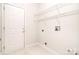 The laundry room features tile floors, a door to the exterior, and wire shelving at 2415 Tory Oak Pl, Matthews, NC 28105