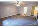 This bedroom features neutral gray walls, carpeted floors, and a ceiling fan for added comfort at 2540 Heritage Cir, Statesville, NC 28625