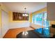 Bright dining room with hardwood floors, modern light fixture, and large windows at 2540 Heritage Cir, Statesville, NC 28625