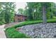Charming brick home with a landscaped front yard, mature trees, and a classic front entrance at 2540 Heritage Cir, Statesville, NC 28625