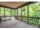 Relaxing screened porch offers views of the private, wooded backyard and ample space for outdoor seating at 2540 Heritage Cir, Statesville, NC 28625