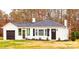 Charming single-story home featuring black shutters, a well-maintained lawn, and a new roof at 2693 Salem Church Rd, Lincolnton, NC 28092