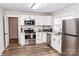 Updated kitchen featuring white cabinets, stainless steel appliances, and sleek hardware at 2693 Salem Church Rd, Lincolnton, NC 28092