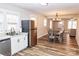 Modern kitchen with stainless steel appliances, granite countertops, and an adjacent dining area at 2693 Salem Church Rd, Lincolnton, NC 28092