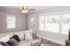 Inviting living room with hardwood floors, neutral walls, and a comfortable sofa filled with decorative pillows at 2693 Salem Church Rd, Lincolnton, NC 28092