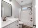 Modern bathroom featuring a white vanity with quartz countertop, bronze fixtures, and a tub with shower at 28647 Nc Hwy 73 Hwy, Albemarle, NC 28001