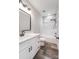 Modern bathroom featuring a white vanity with quartz countertop, bronze fixtures, and a tub with shower at 28647 Nc Hwy 73 Hwy, Albemarle, NC 28001