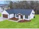 Charming single-story home with white siding, a dark roof, and a well-manicured lawn at 28647 Nc Hwy 73 Hwy, Albemarle, NC 28001