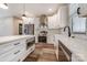 Modern kitchen with white cabinets, stainless steel appliances, and a center island at 28647 Nc Hwy 73 Hwy, Albemarle, NC 28001