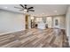 Open concept living room with hardwood floors and abundant natural light at 28647 Nc Hwy 73 Hwy, Albemarle, NC 28001
