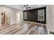 Spacious main bedroom with a feature wall and natural light from two windows at 28647 Nc Hwy 73 Hwy, Albemarle, NC 28001