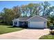 Charming single-story home with a well-maintained lawn and attached two-car garage at 295 Green Meadows Dr, Taylorsville, NC 28681