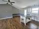 Open-concept kitchen featuring a kitchen island, white cabinets, and stainless steel appliances at 295 Green Meadows Dr, Taylorsville, NC 28681