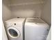 Laundry room featuring a washer and dryer with shelving above at 295 Green Meadows Dr, Taylorsville, NC 28681