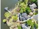 Breathtaking aerial view of home nestled on tree-lined peninsula with private dock at 302 Patterson'S Bridge None, New London, NC 28127