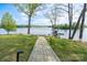 View of lake from backyard through landscaped path leading to private dock at 302 Patterson'S Bridge None, New London, NC 28127