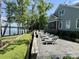 Backyard with artificial turf bocce court and stone patio with lake views at 302 Patterson'S Bridge None, New London, NC 28127