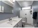 Modern bathroom with white countertops, quartz shower, gray paint and contemporary fixtures for a stylish feel at 302 Patterson'S Bridge None, New London, NC 28127