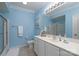 Bright bathroom with white vanity, blue accents, and a clean design providing a relaxing and functional space at 302 Patterson'S Bridge None, New London, NC 28127