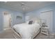 Light blue bedroom with a queen bed, white furnishings, and a peaceful, inviting ambiance at 302 Patterson'S Bridge None, New London, NC 28127