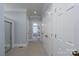 Hallway leading to bathroom with stylish decor and a view of a marble-tiled bathroom at 302 Patterson'S Bridge None, New London, NC 28127