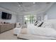 Bright bedroom with water views and neutral decor and a tray ceiling at 302 Patterson'S Bridge None, New London, NC 28127