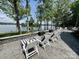 Stone patio with lounge chairs overlooking the lake and trees at 302 Patterson'S Bridge None, New London, NC 28127