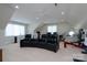 Bright theater room features comfortable seating, recessed lights, ceiling fans, and fitness equipment at 302 Patterson'S Bridge None, New London, NC 28127