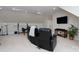 Angle view of theater room featuring black leather seating, television and neutral carpet at 302 Patterson'S Bridge None, New London, NC 28127