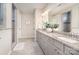 This bathroom boasts a spacious vanity with granite countertops, complemented by elegant fixtures and neutral decor at 3028 Quinebaug Rd, Fort Mill, SC 29715