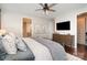 A cozy bedroom showcases a comfortable bed, a modern dresser, and a convenient doorway to the bathroom and closet at 3028 Quinebaug Rd, Fort Mill, SC 29715