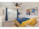 Bright bedroom featuring a ceiling fan, window, and Golden State Warriors themed decor at 3028 Quinebaug Rd, Fort Mill, SC 29715
