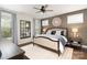 This bedroom features a ceiling fan, stylish decor, and a neutral color palette, creating a welcoming atmosphere at 3028 Quinebaug Rd, Fort Mill, SC 29715