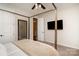 The bedroom features a four-poster bed, a sleek TV, and a convenient doorway for comfort and entertainment at 3028 Quinebaug Rd, Fort Mill, SC 29715