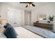 This bedroom boasts a modern dresser, ceiling fan, and ample closet space, blending style and functionality at 3028 Quinebaug Rd, Fort Mill, SC 29715