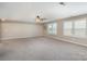 Bright bonus room featuring neutral carpet and two windows at 3028 Quinebaug Rd, Fort Mill, SC 29715